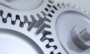 motion gears -team force Three gears in action. Shallow dof, focus in the theeth that make contact. Metaphorical illustration of Industrial workforce, business worflow, teamwork cooperation, energy, transmition,  motor
